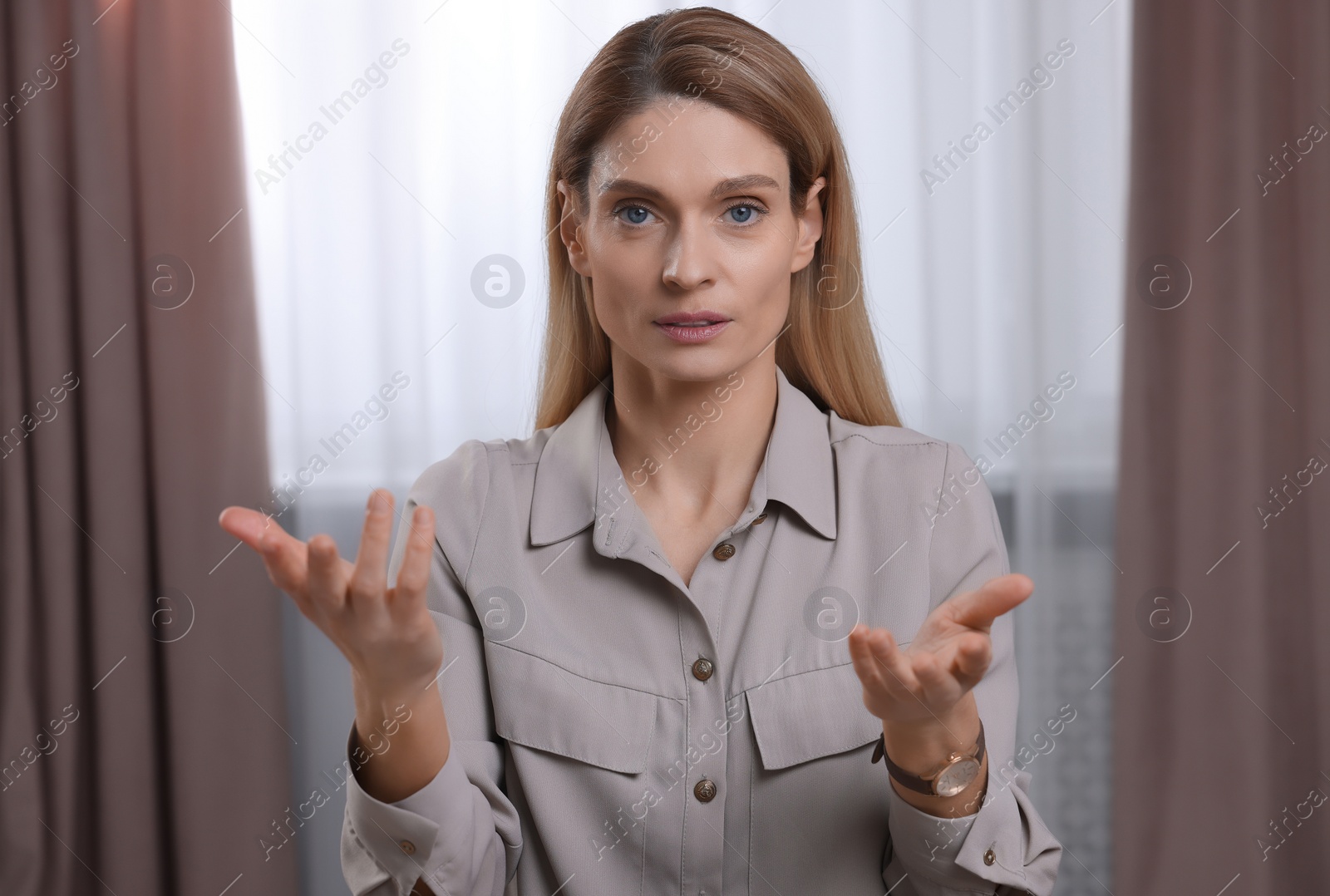 Photo of Woman having video call indoors, view from web camera