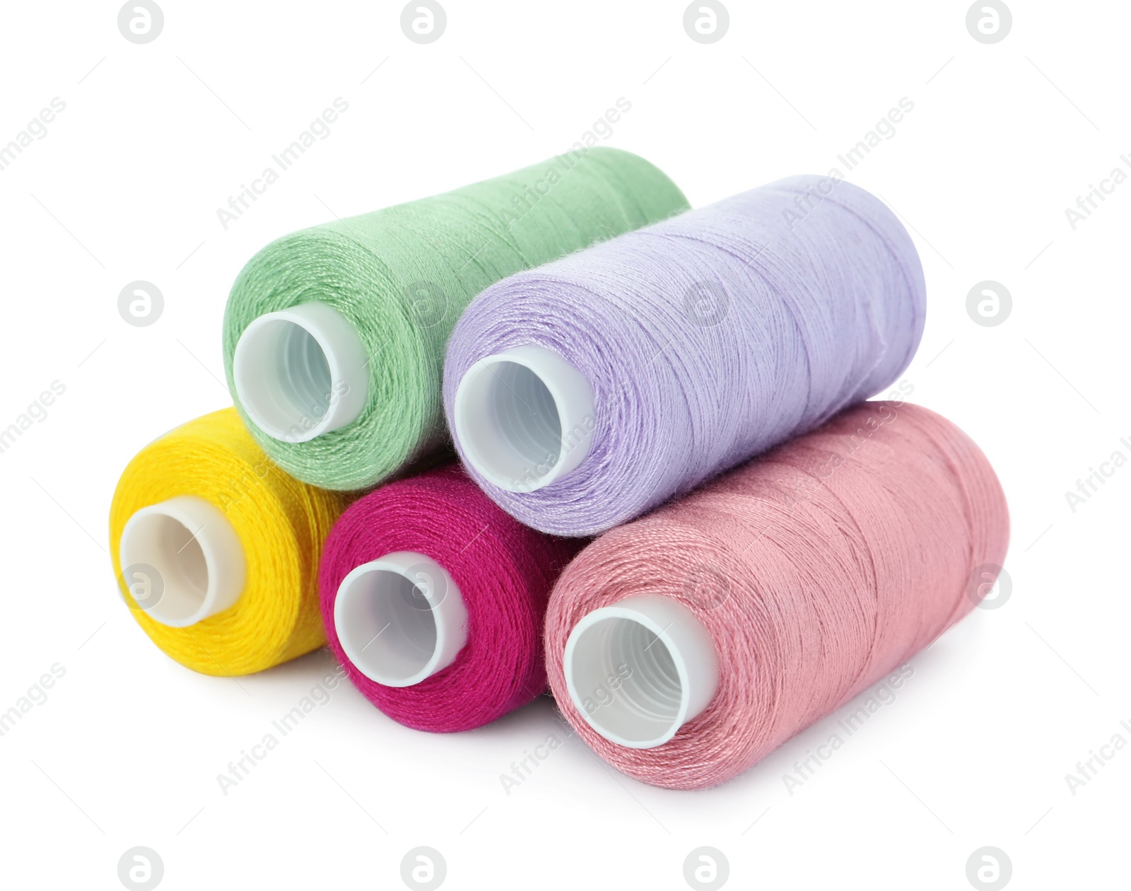 Photo of Different colorful sewing threads on white background