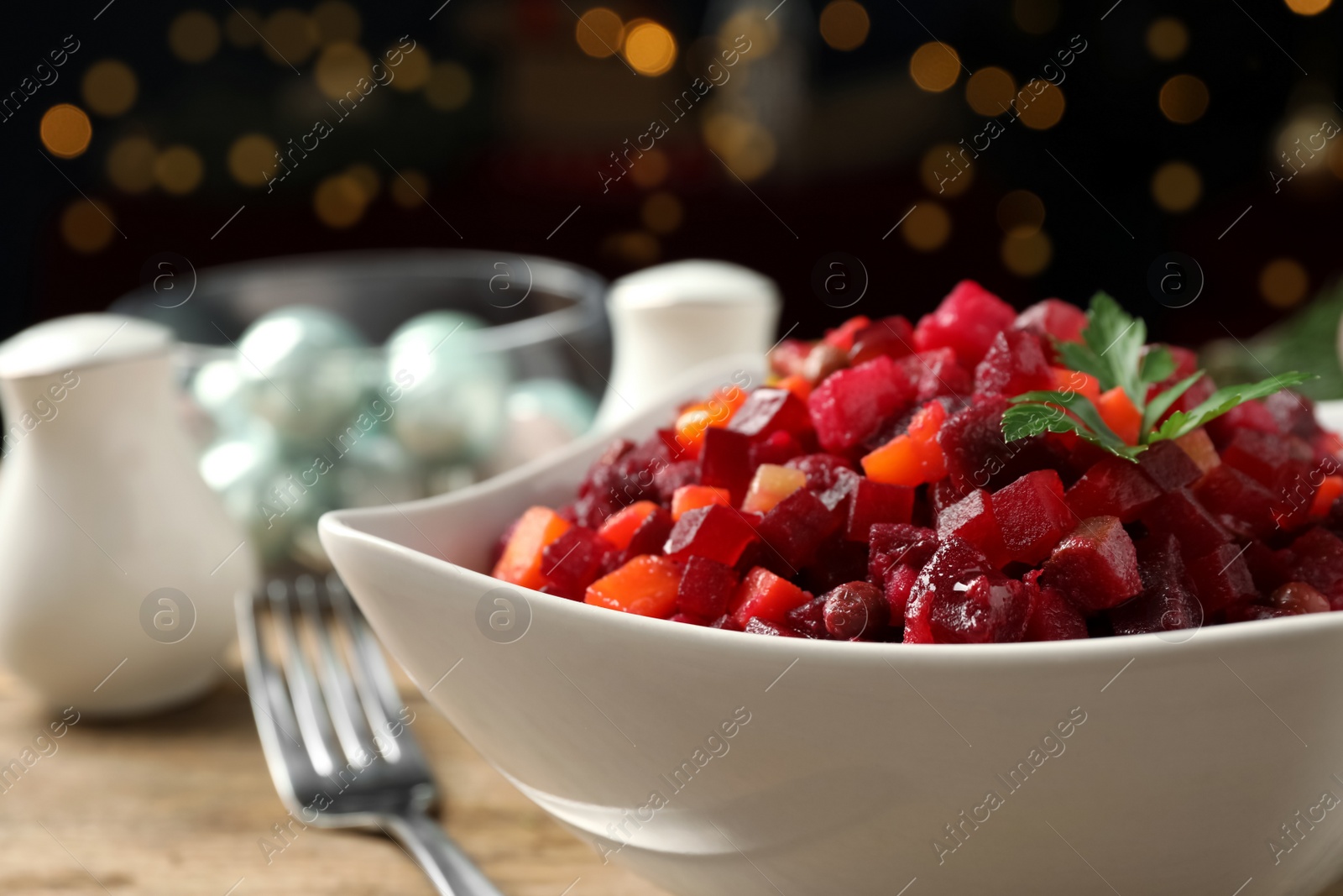 Photo of Traditional Russian salad vinaigrette in bowl, closeup