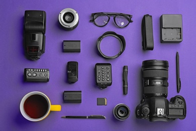 Photo of Flat lay composition with photographer's equipment and accessories on color background