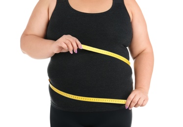 Photo of Overweight woman with measuring tape on white background, closeup