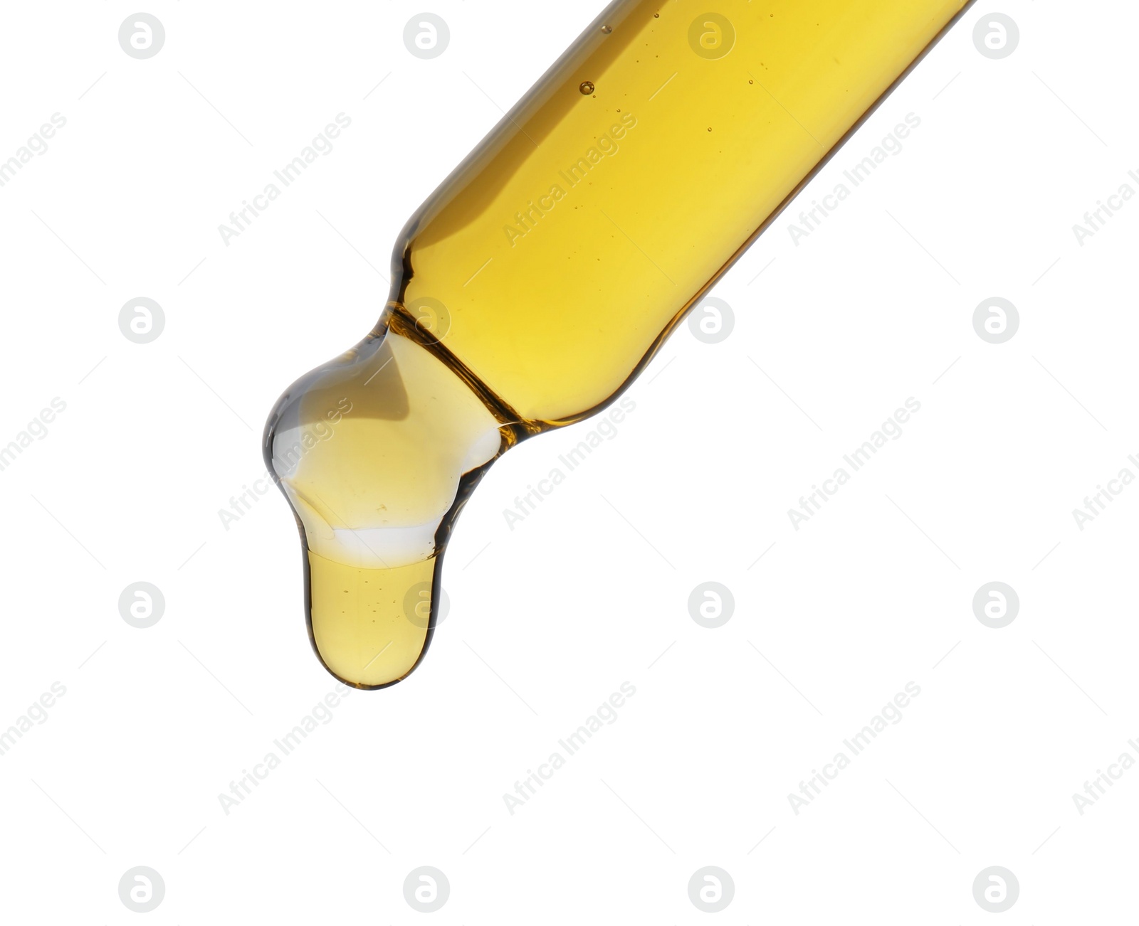 Photo of Dripping tincture from pipette isolated on white