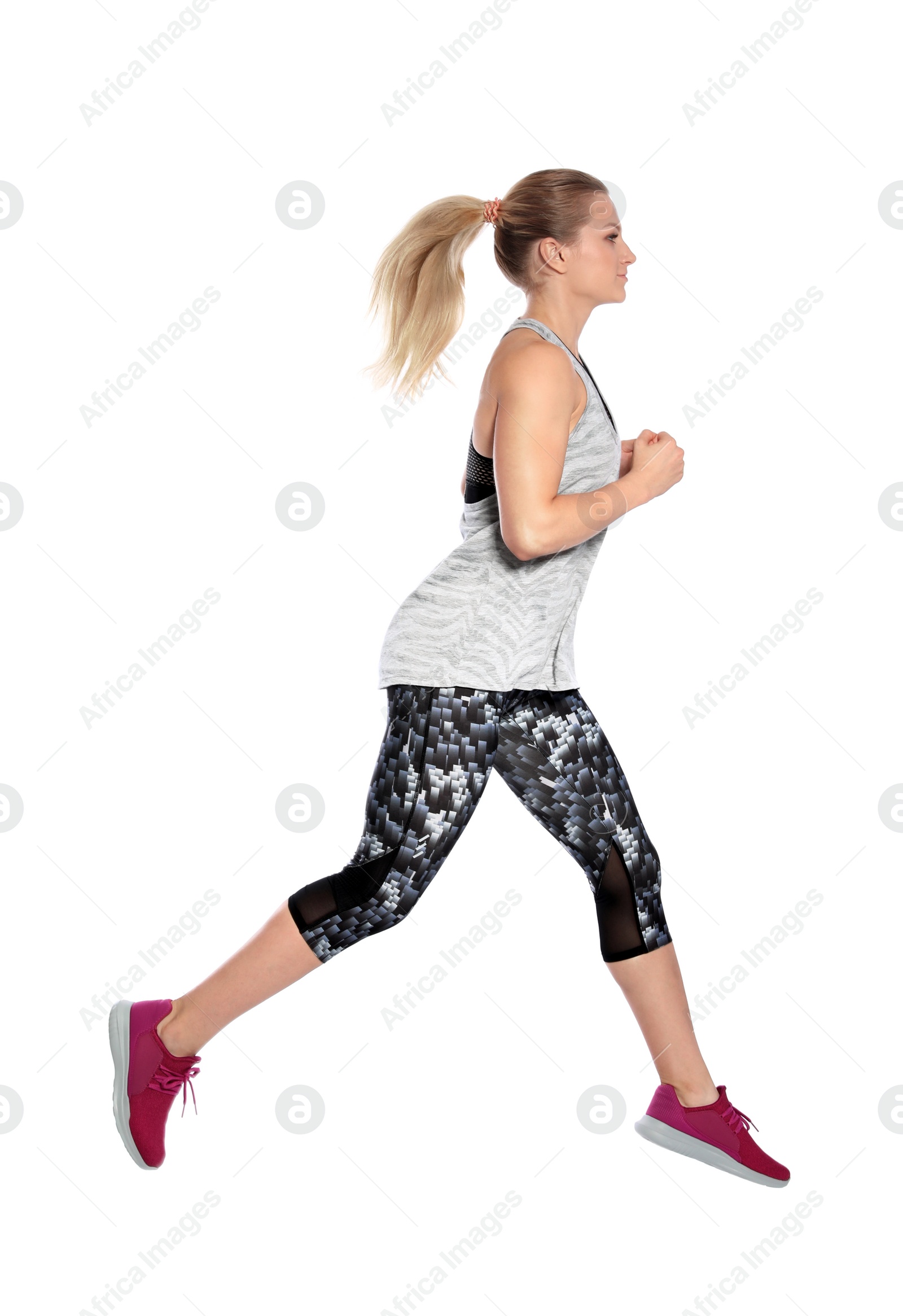 Photo of Sporty young woman running on white background