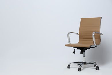 Photo of Comfortable office chair on white background, space for text