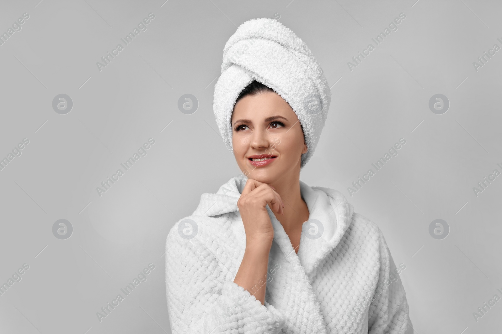 Photo of Beautiful woman with clean perfect skin on light background