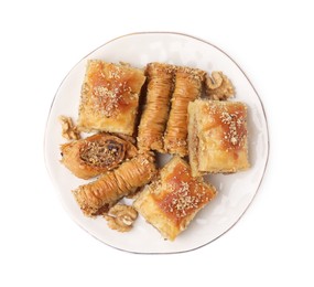 Photo of Eastern sweets. Pieces of tasty baklava isolated on white, top view