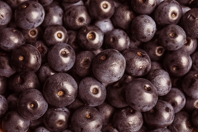 Fresh acai berries as background