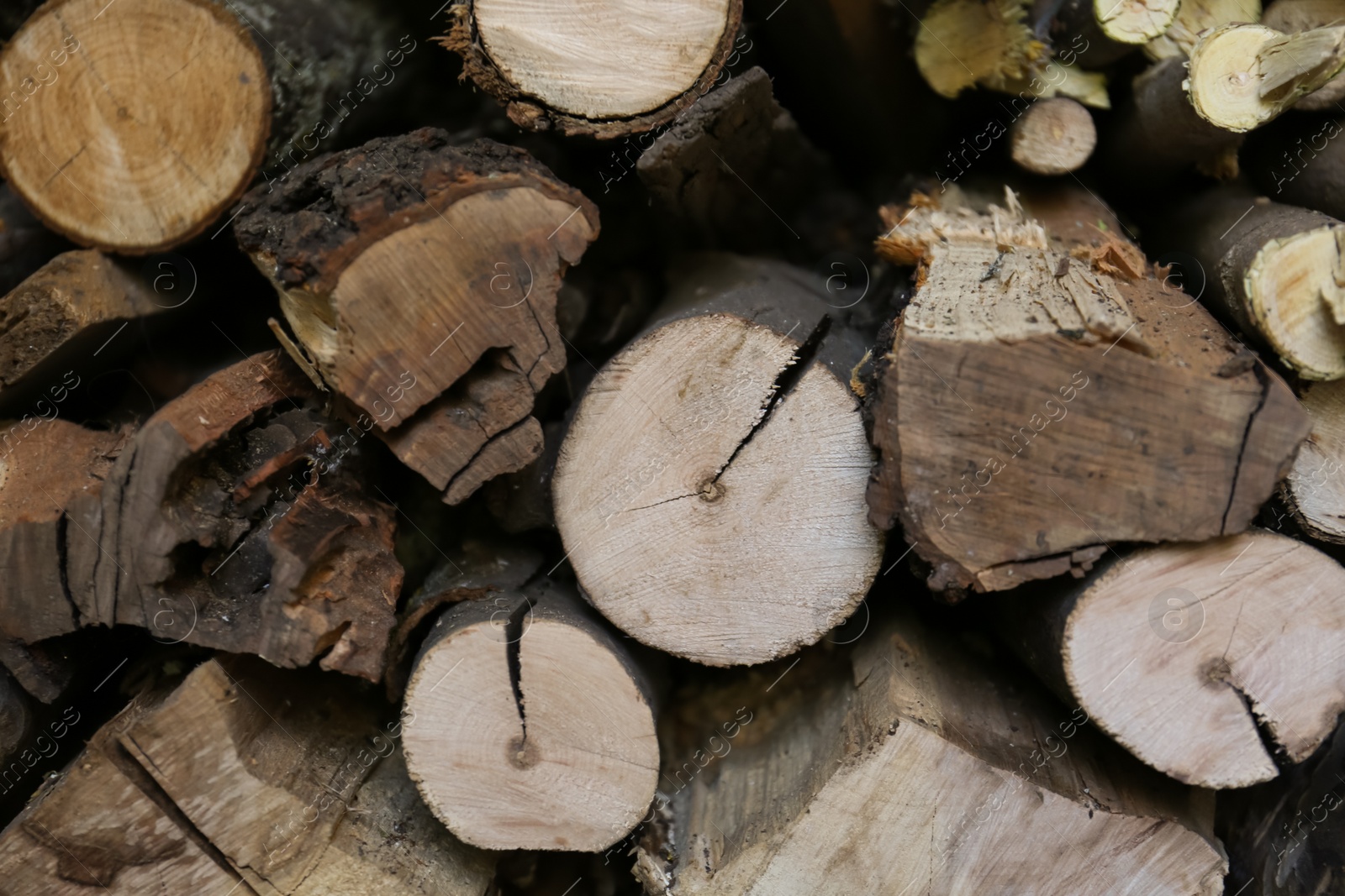 Photo of Stacked firewood as background. Heating house in winter