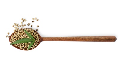 Photo of Spoon with hemp seeds and green leaf on white background, top view