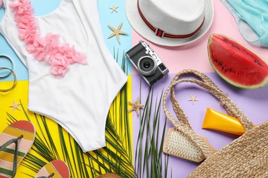 Photo of Composition with beach accessories on color background, flat lay