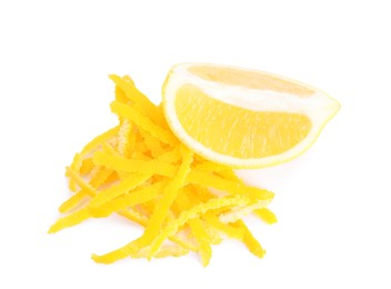 Photo of Grated lemon zest and fresh fruit on white background