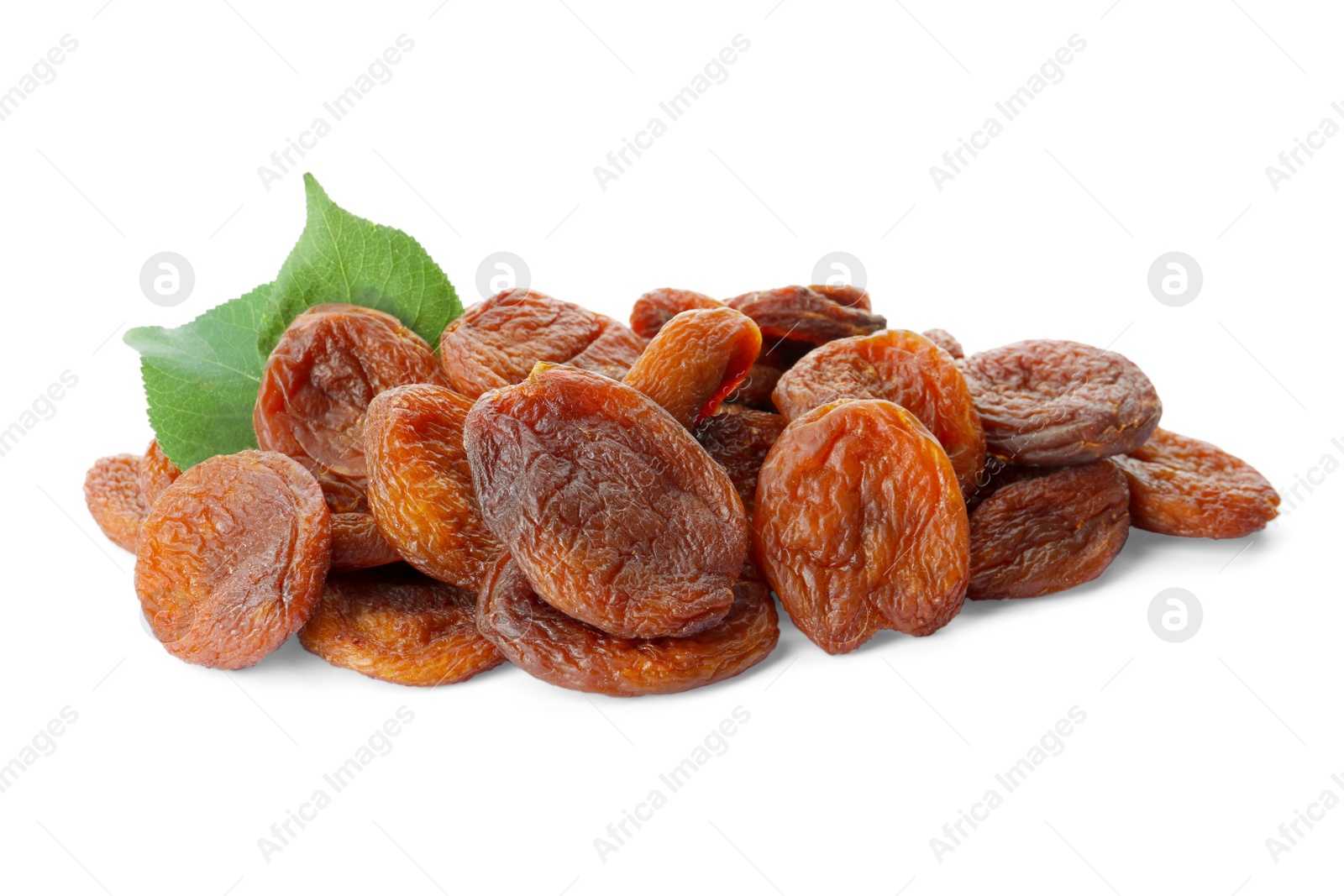 Photo of Tasty dried apricots and leaves on white background