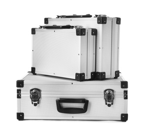 Photo of Set of aluminum hard cases on white background