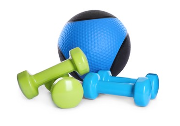 Photo of Blue and black medicine ball with dumbbells on white background