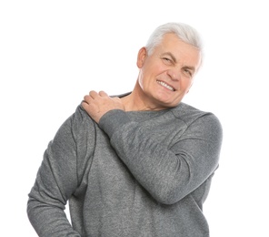 Photo of Mature man scratching shoulder on white background. Annoying itch