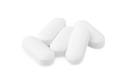 Photo of Pile of calcium supplement pills on white background