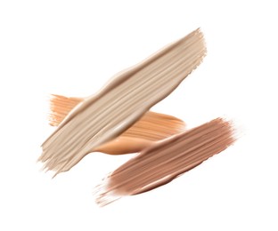 Image of Different shades of liquid foundation on white background, top view