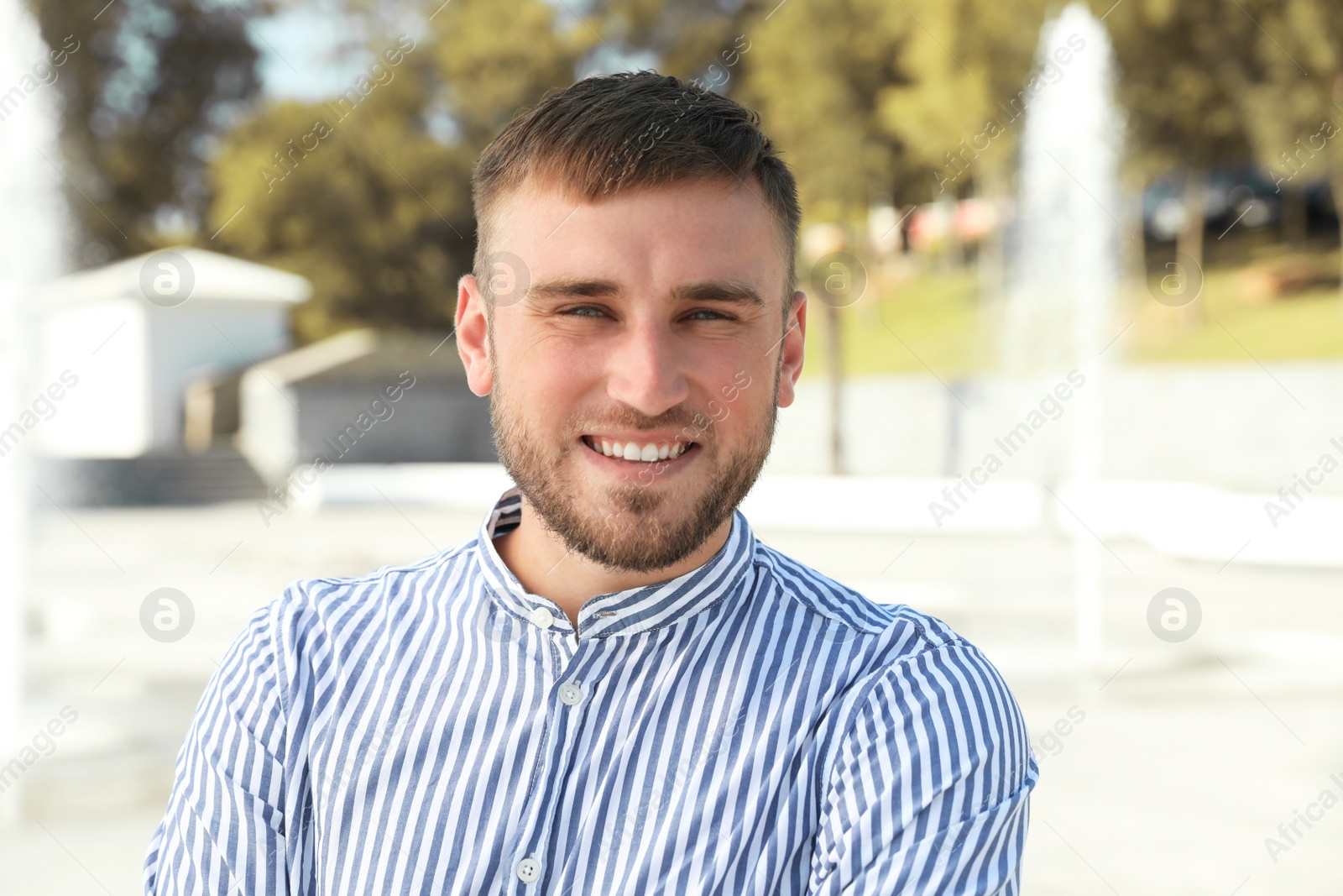 Photo of Portrait of handsome young man on street