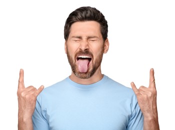 Photo of Man showing his tongue and rock gesture on white background