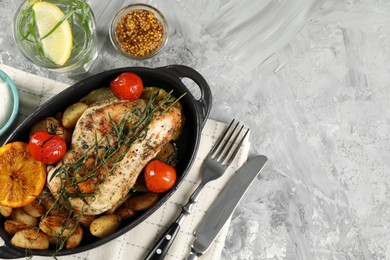 Photo of Tasty chicken, vegetables, drink with tarragon and mustard served on grey table, flat lay. Space for text