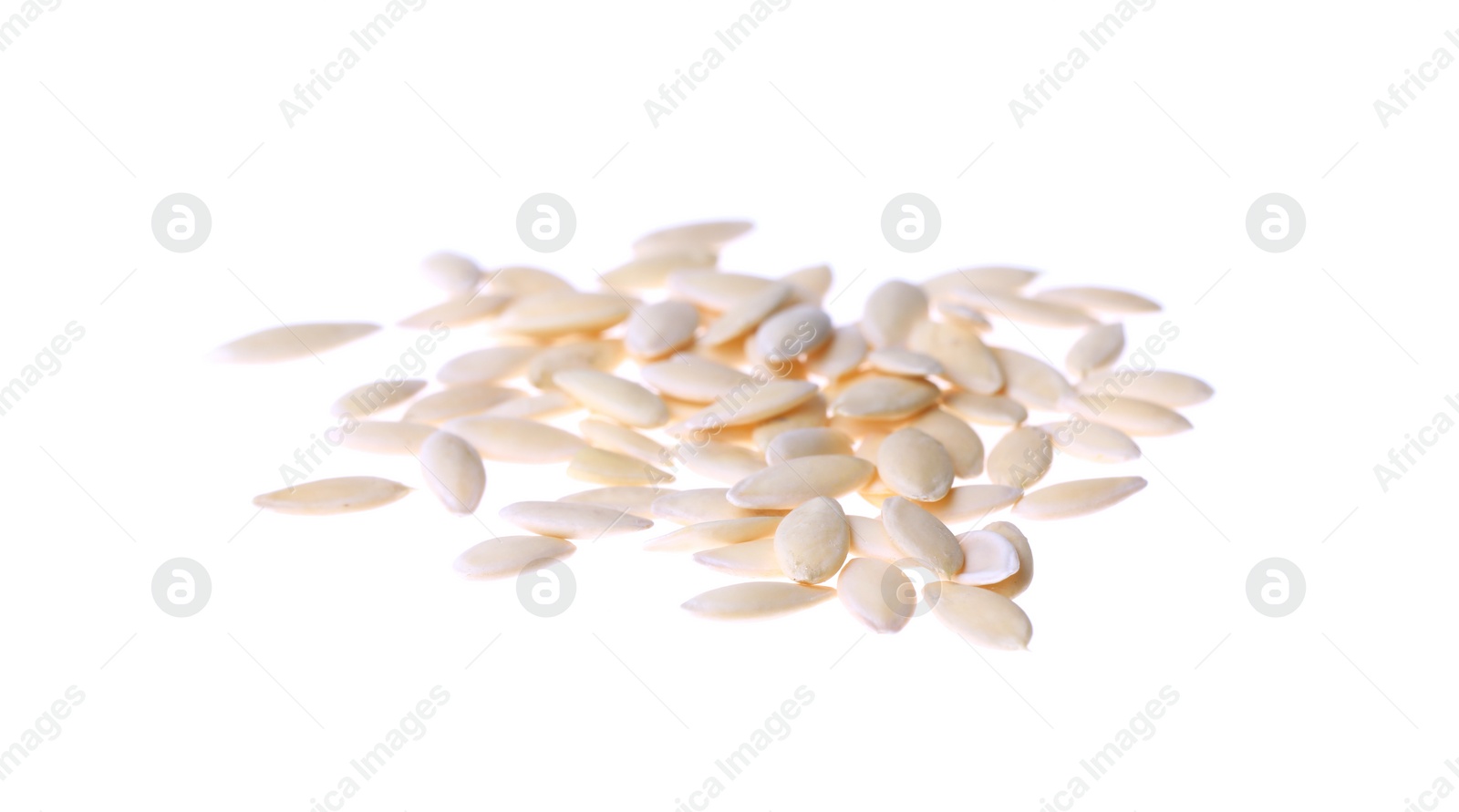 Photo of Pile of raw cucumber seeds on white background. Vegetable planting