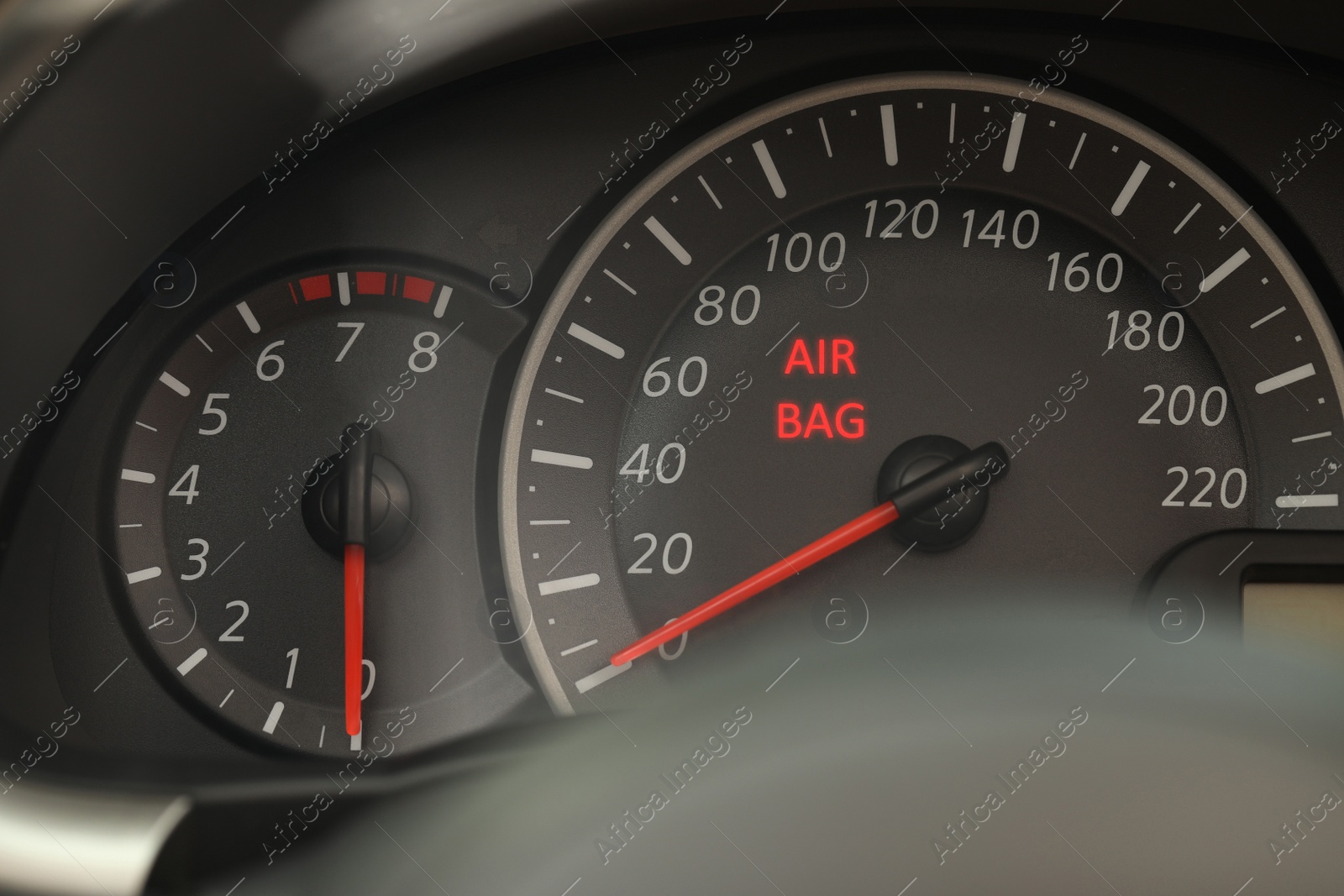 Image of Closeup view of dashboard with warning icon check airbag system in car