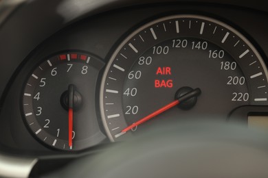 Image of Closeup view of dashboard with warning icon check airbag system in car