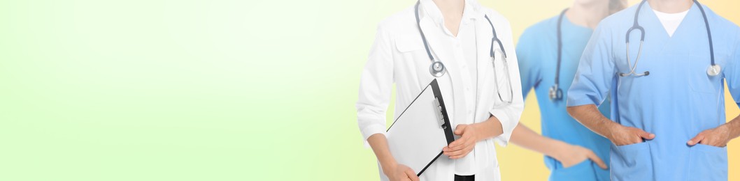 Image of Doctors and nurse on light green background, closeup. Banner design with space for text