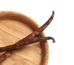 Photo of Plate with aromatic vanilla sticks on white background