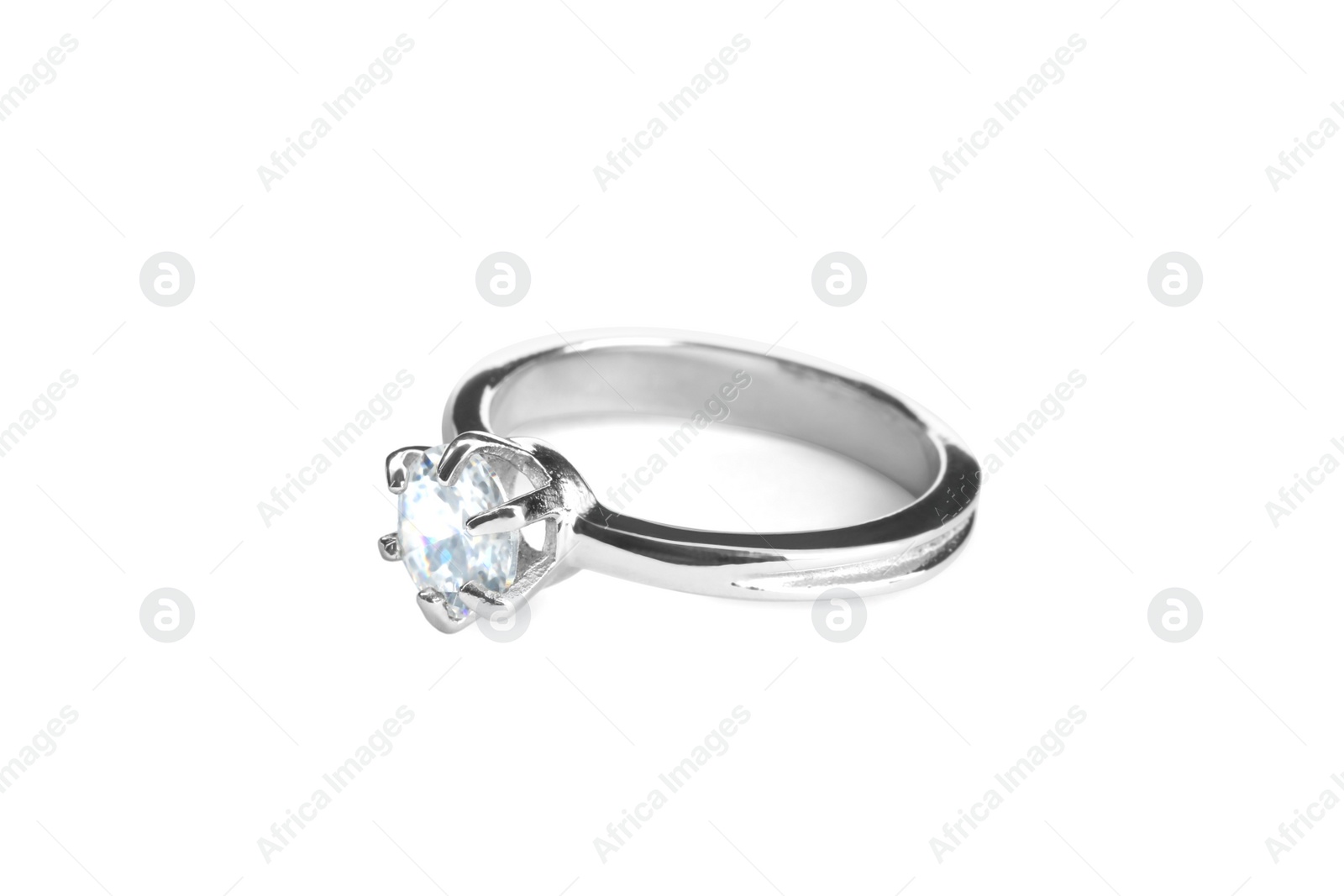 Photo of Beautiful engagement ring with gemstone isolated on white