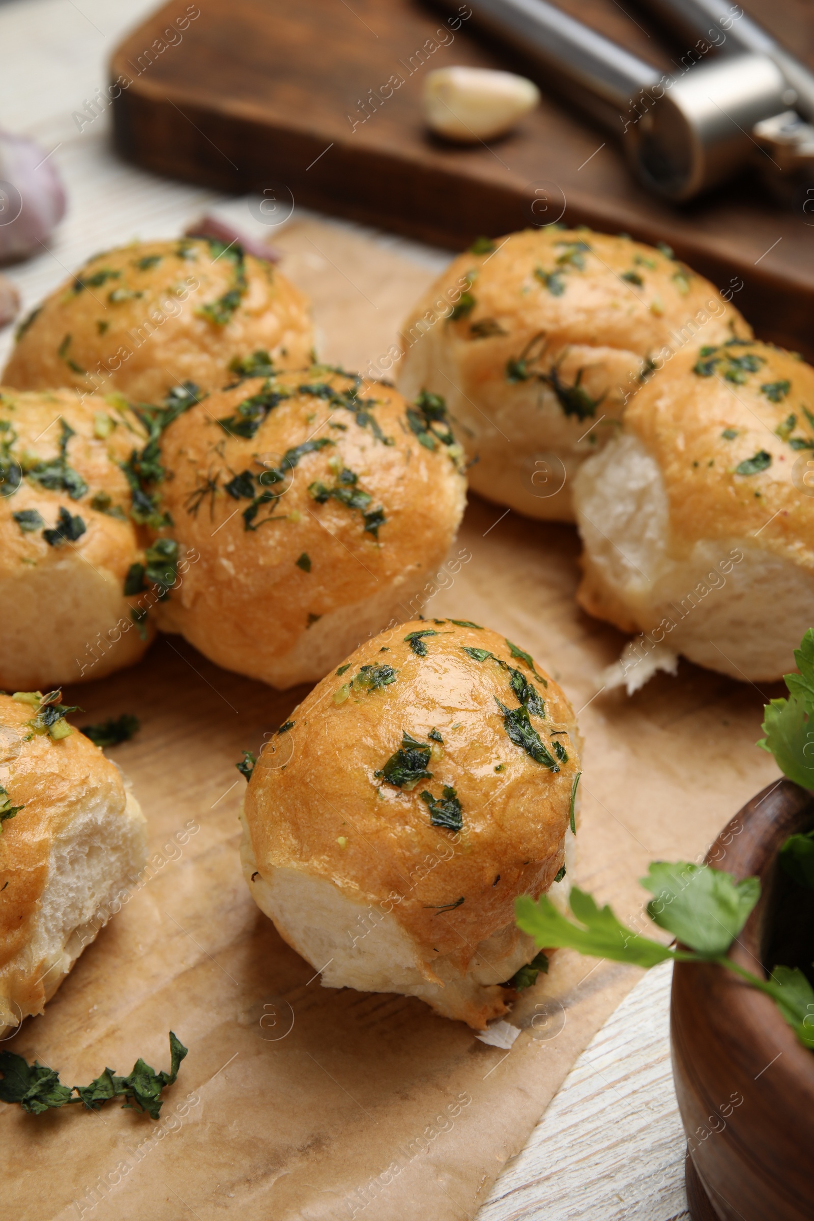 Photo of Traditional Ukrainian bread (Pampushky) with garlic on parchment