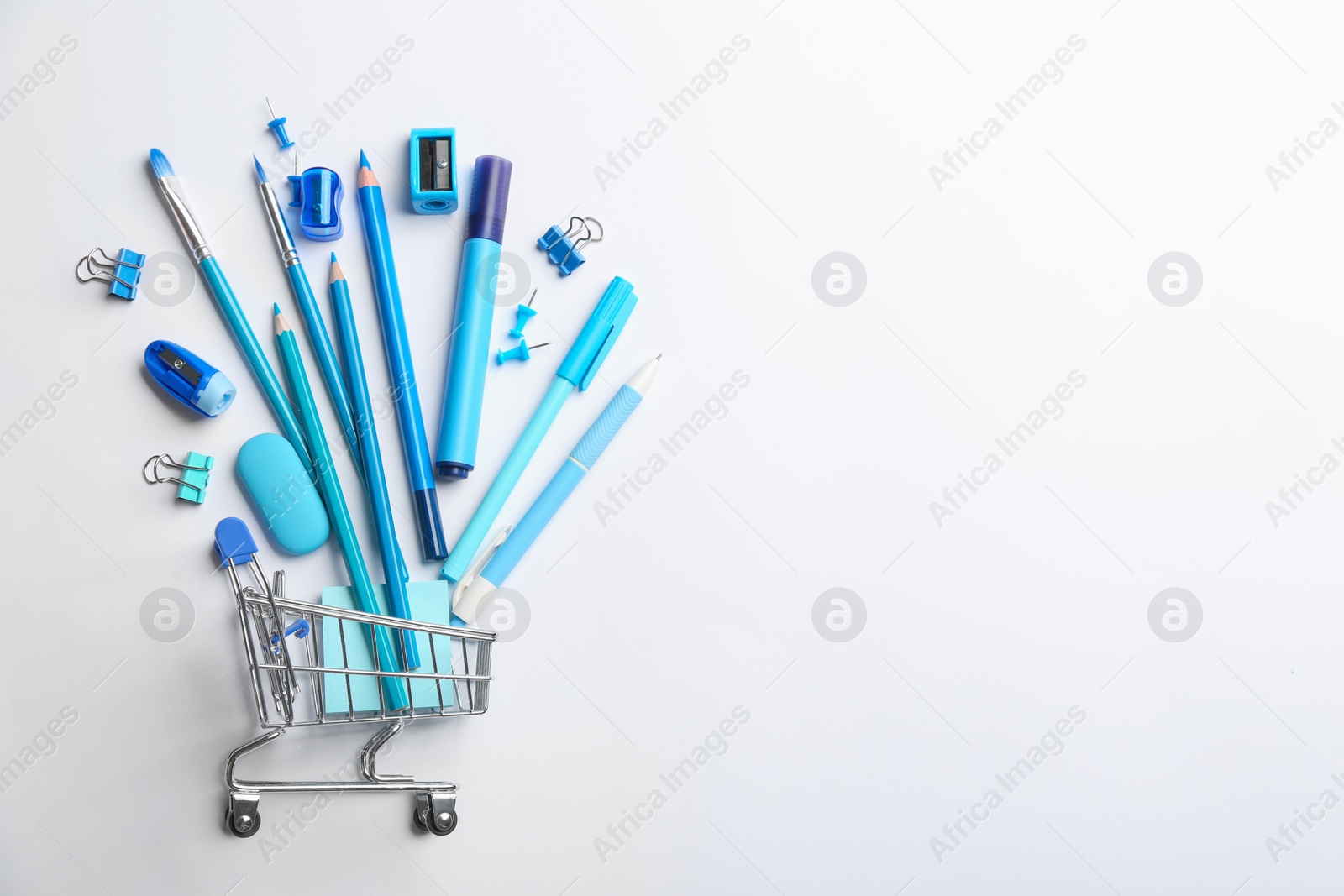 Photo of Flat lay composition with school stationery on white background, space for text. Back to school