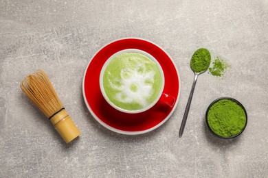 Flat lay composition with tasty matcha latte on light gray table