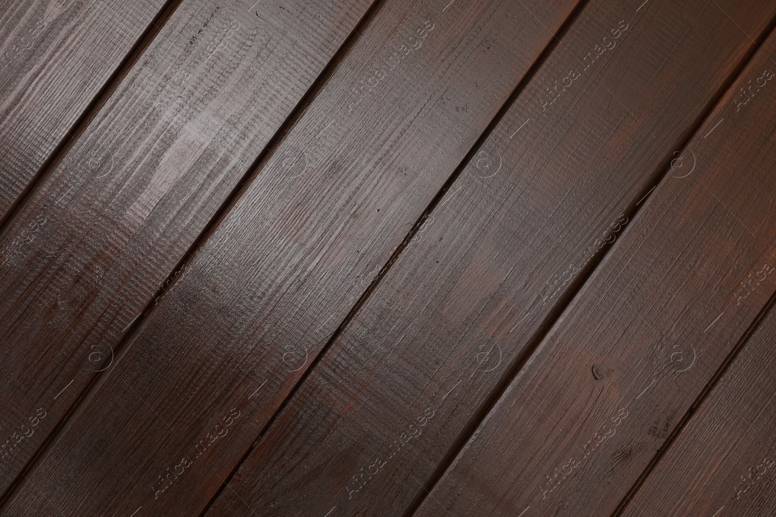 Photo of Texture of dark wooden surface as background, top view