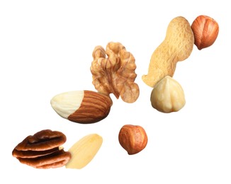 Many different nuts in air on white background