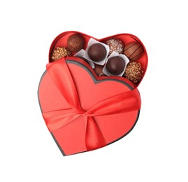 Photo of Heart shaped box with delicious chocolate candies isolated on white, top view