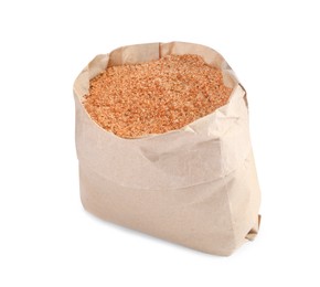 Photo of Pink salt with spices in paper bag isolated on white