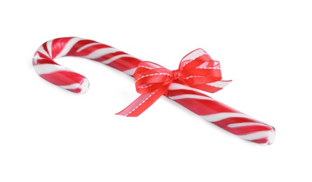 Sweet Christmas candy cane with red bow isolated on white