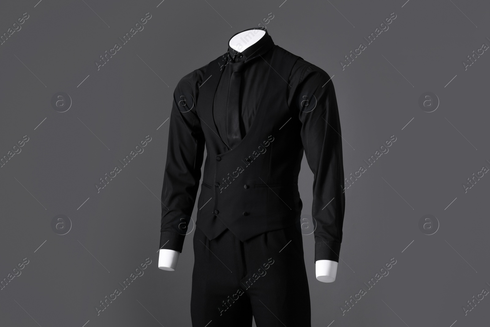 Photo of Male mannequin dressed in stylish black suit on grey background