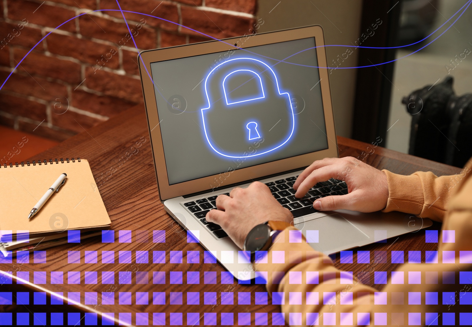 Image of Cyber attack protection. Man using laptop with lock illustration on screen at table, closeup