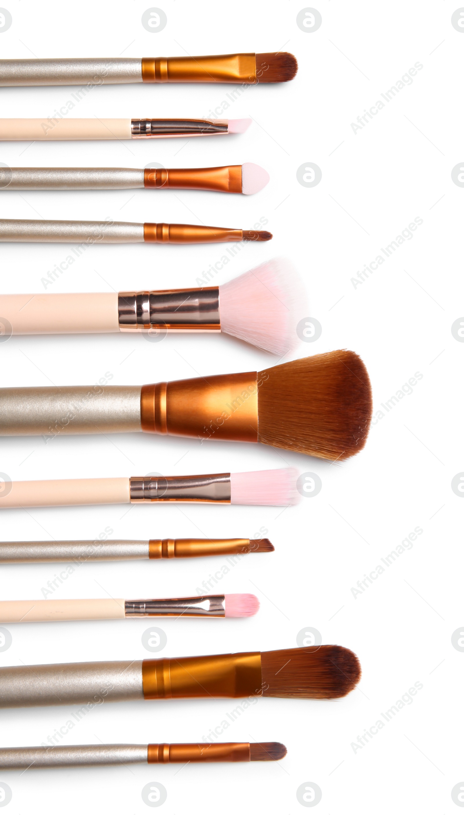 Photo of Flat lay composition with makeup brushes of professional artist on white background