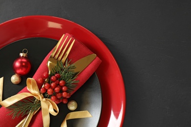 Photo of Beautiful Christmas table setting on black background, top view