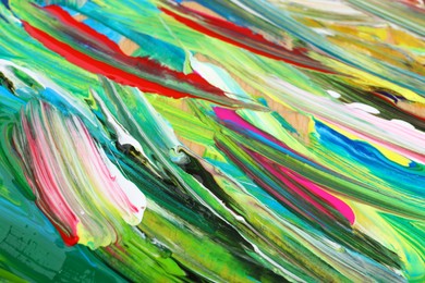 Photo of Abstract colorful acrylic paint as background, closeup view