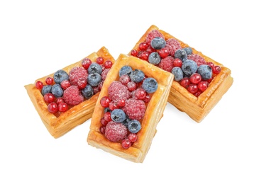 Fresh delicious puff pastry with sweet berries on white background