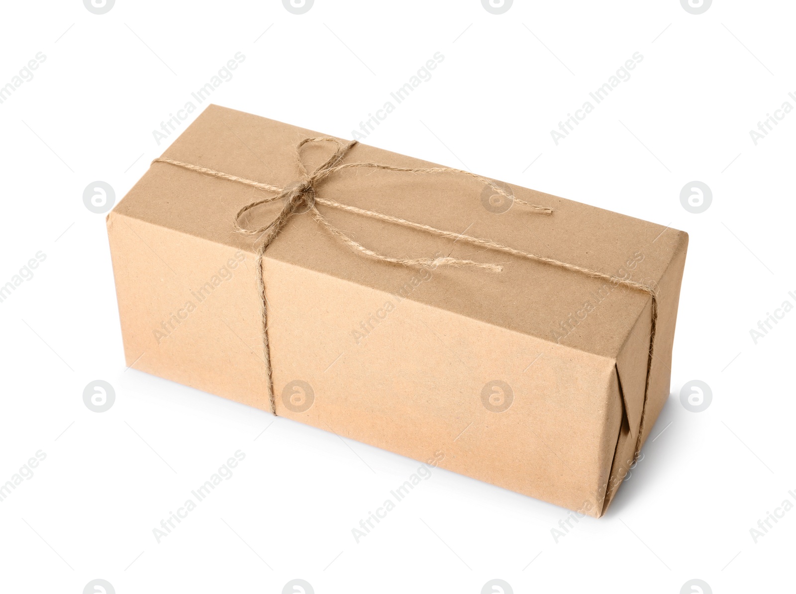 Photo of Parcel wrapped with kraft paper and twine isolated on white