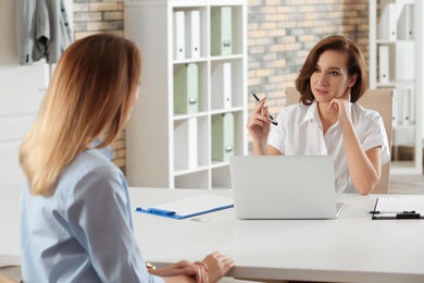 Photo of Human resources manager conducting job interview with applicant in office