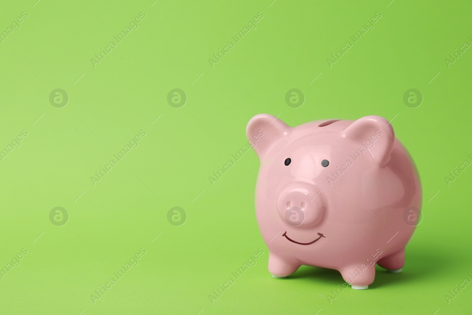 Photo of Pink piggy bank on color background. Money saving