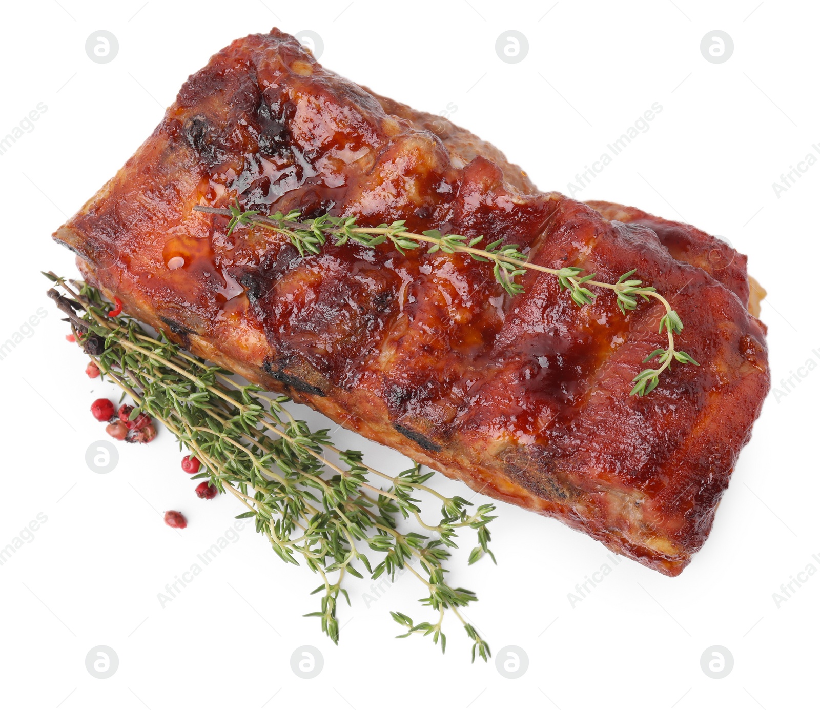 Photo of Tasty roasted pork ribs and thyme isolated on white, top view
