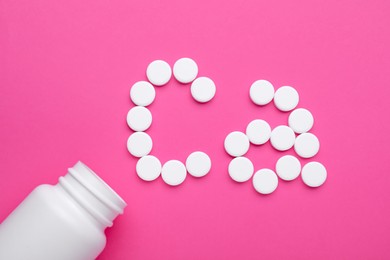 Photo of Calcium symbol made of white pills and open bottle on pink background, flat lay