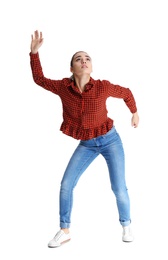 Young woman attracted to magnet on white background